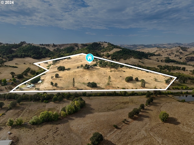 bird's eye view with a mountain view and a rural view