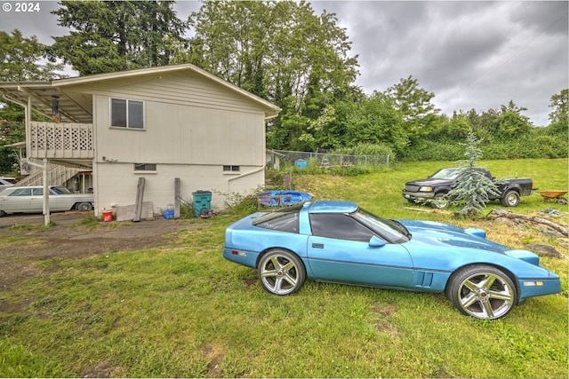 view of side of property featuring a yard