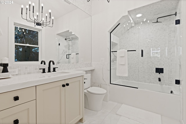 full bathroom with enclosed tub / shower combo, vanity, a notable chandelier, tile walls, and toilet