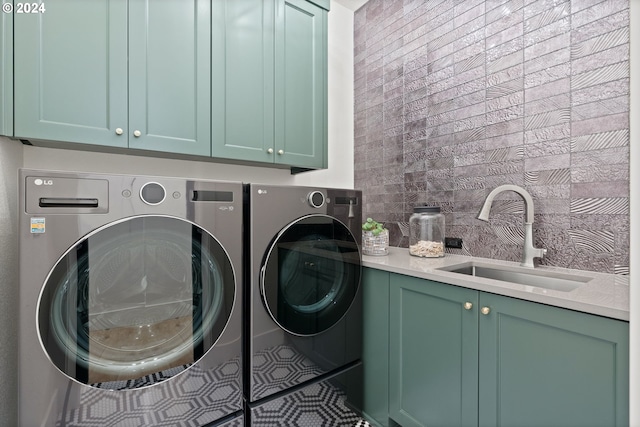 laundry room with cabinets, sink, and independent washer and dryer