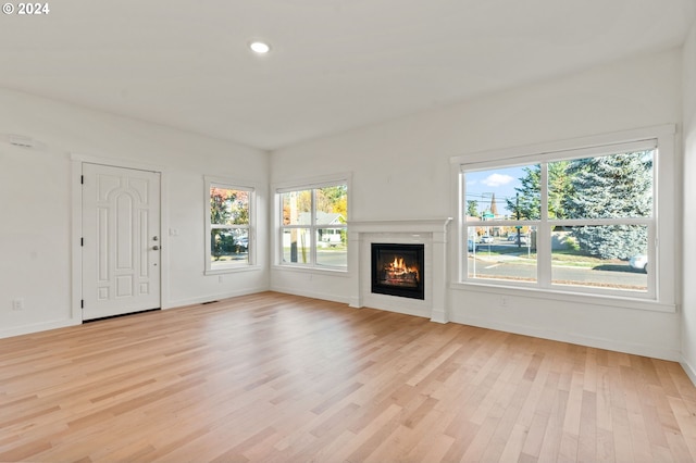 unfurnished living room featuring light hardwood / wood-style flooring