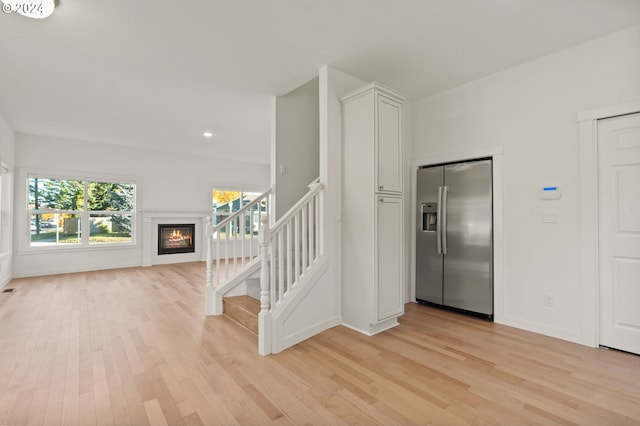 foyer entrance with light hardwood / wood-style flooring