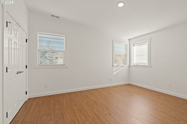 empty room with light wood-type flooring