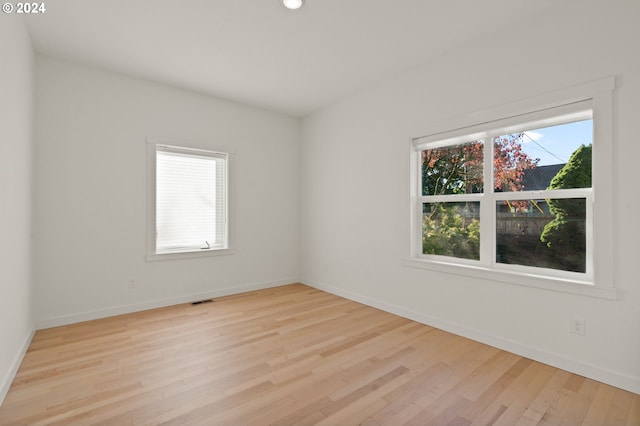 unfurnished room featuring light wood-type flooring