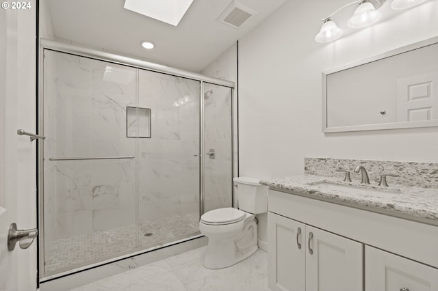 bathroom with toilet, an enclosed shower, vanity, and a skylight