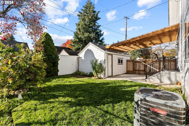 view of yard featuring a patio area, cooling unit, and a shed