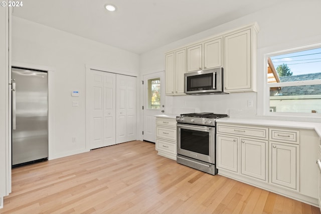 kitchen featuring light hardwood / wood-style flooring and appliances with stainless steel finishes