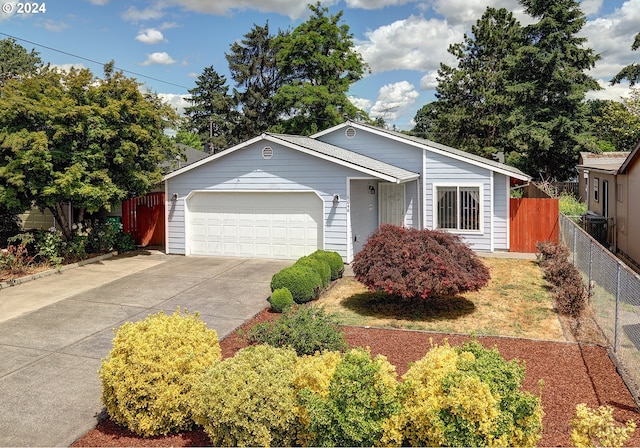 single story home featuring a garage