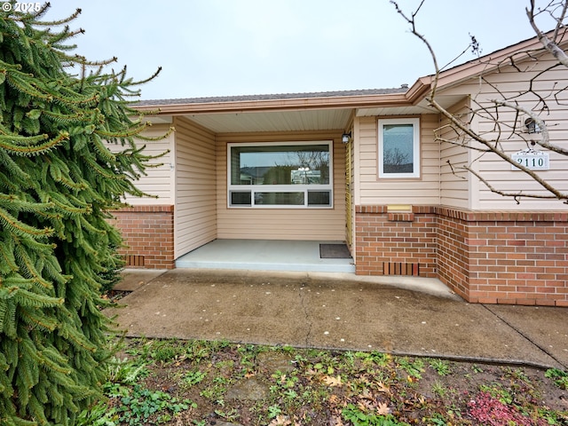 back of property featuring a patio area