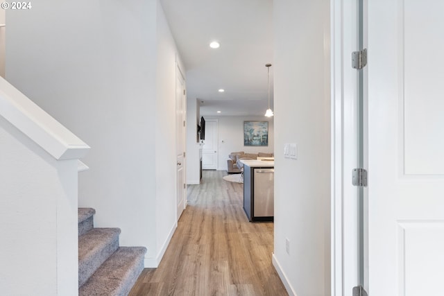 hallway with light wood-type flooring