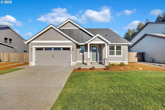 view of front of house with a garage and a front yard