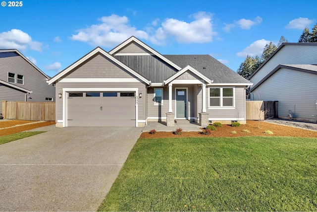 view of front of home with a garage and a front lawn