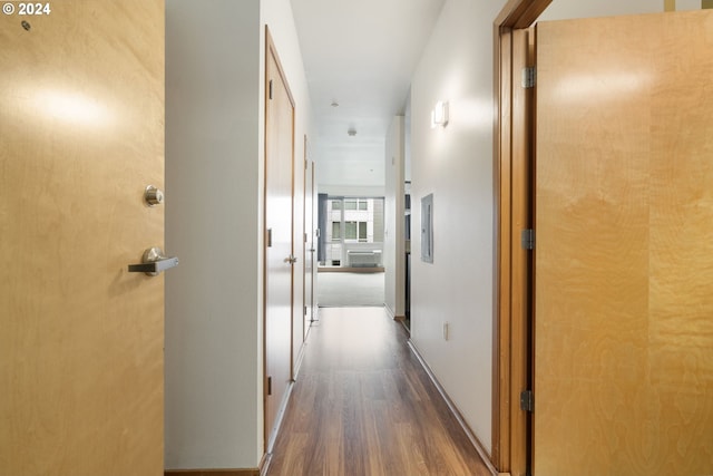 hallway with dark hardwood / wood-style floors