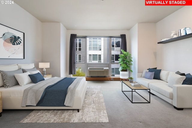 carpeted bedroom featuring an AC wall unit