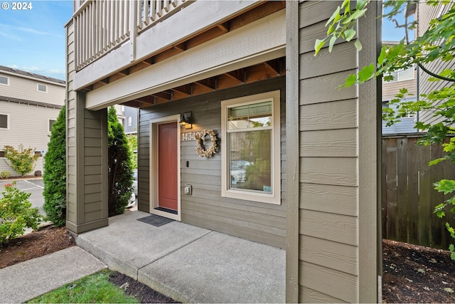 entrance to property with a balcony