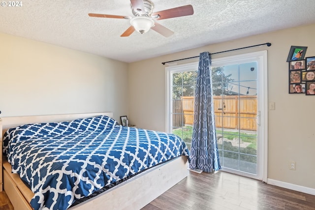 bedroom with access to outside, ceiling fan, wood-type flooring, and a textured ceiling