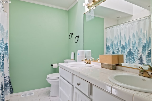 bathroom featuring tile patterned flooring, vanity, toilet, and ornamental molding