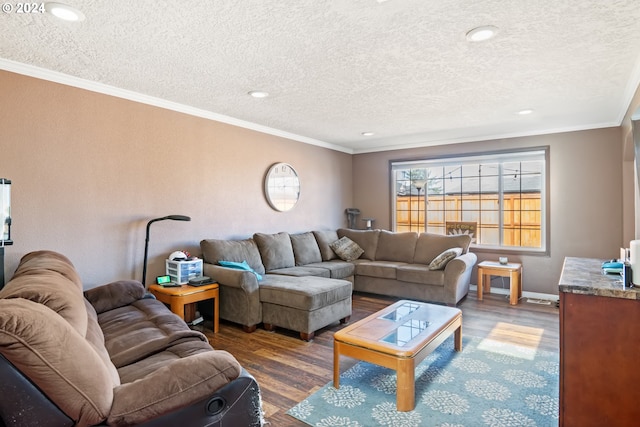 living room featuring a textured ceiling, dark hardwood / wood-style flooring, and ornamental molding