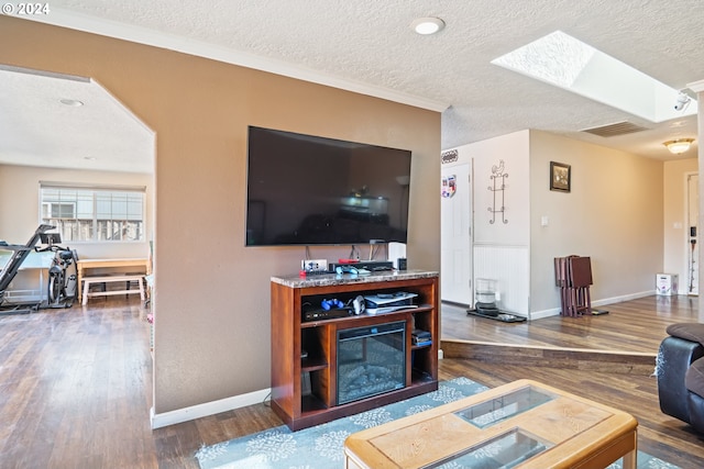 living room with hardwood / wood-style floors and a textured ceiling