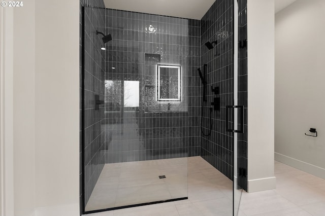 bathroom featuring tile patterned floors and tiled shower