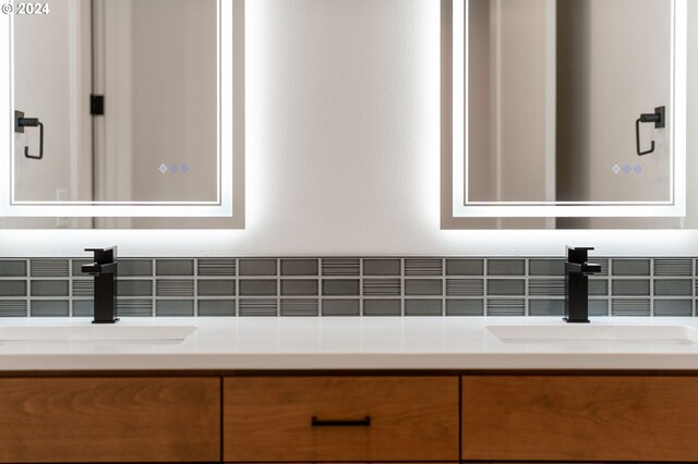 laundry room featuring electric dryer hookup, hookup for a washing machine, light tile patterned floors, and cabinets