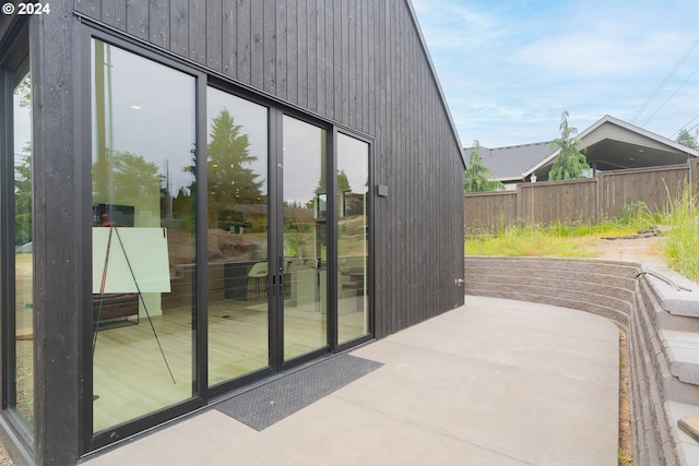 entryway featuring wood walls