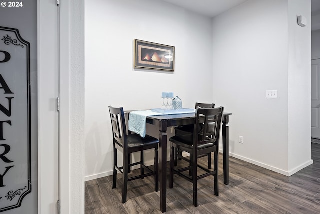 dining room featuring dark hardwood / wood-style flooring