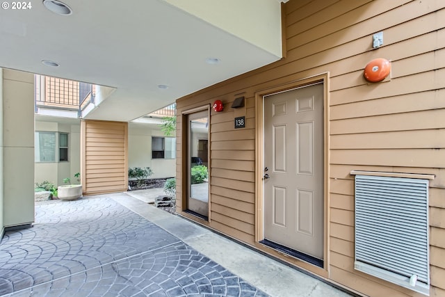 doorway to property featuring a patio area