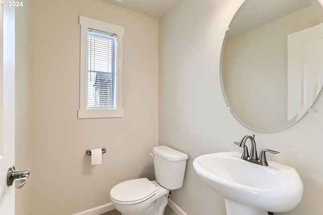 bathroom featuring sink and toilet