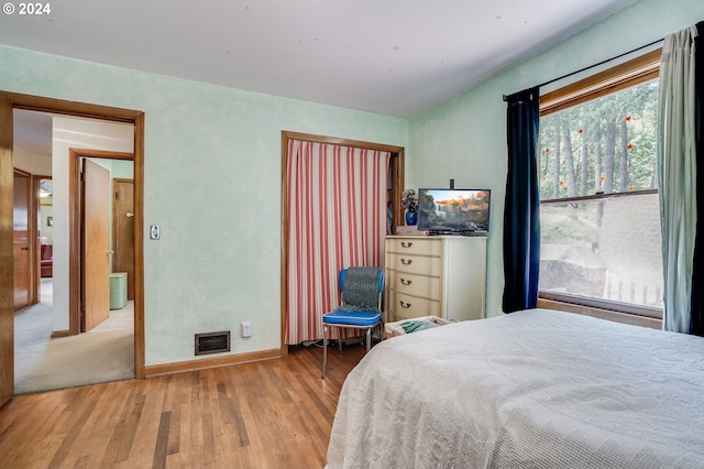 23175 NE Ridge Rd, Gaston, OR 97119 - bedroom featuring baseboards, wood finished floors, and visible vents