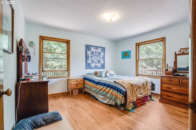 bedroom with light hardwood / wood-style flooring