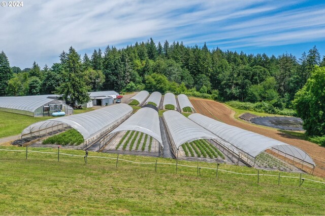 birds eye view of property with a rural view