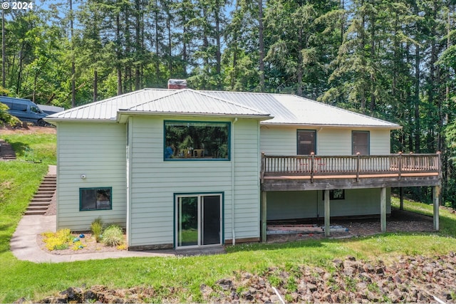 back of house featuring a deck