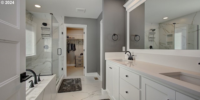 bathroom with shower with separate bathtub and vanity