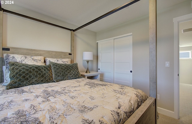 carpeted bedroom featuring a closet