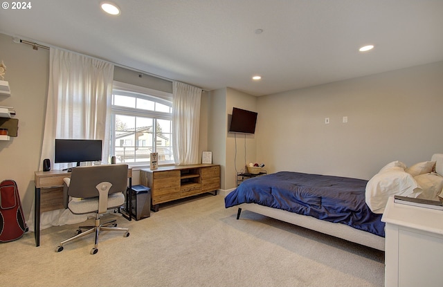 bedroom featuring light carpet