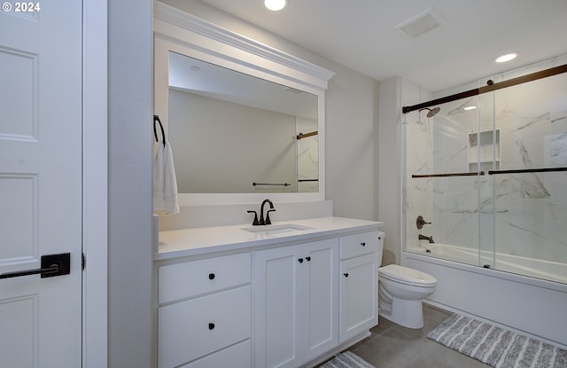 full bathroom with vanity, shower / bath combination with glass door, and toilet