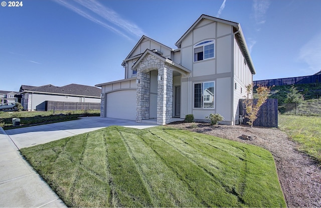 view of front facade with a garage and a front lawn