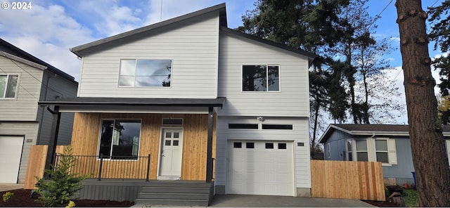 view of front of property with a porch and a garage