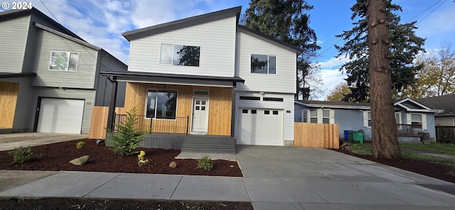 view of front facade featuring a porch and a garage