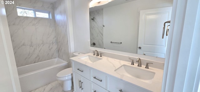 full bathroom with vanity, toilet, and tiled shower / bath