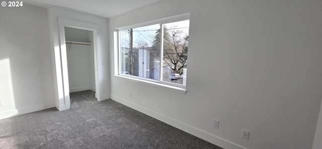 unfurnished bedroom with carpet and a closet