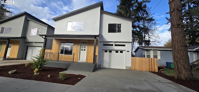 view of front of house with a porch and a garage