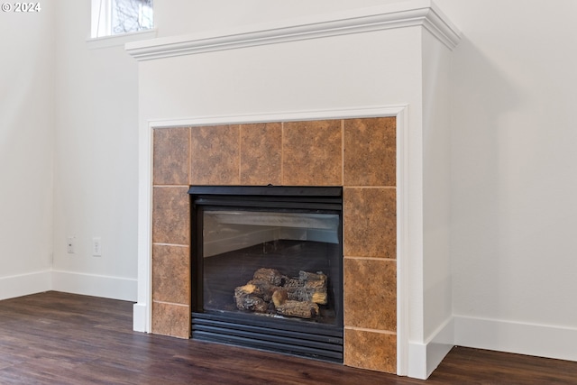 interior details with hardwood / wood-style floors and a fireplace