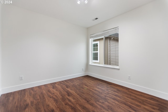 spare room with wood-type flooring