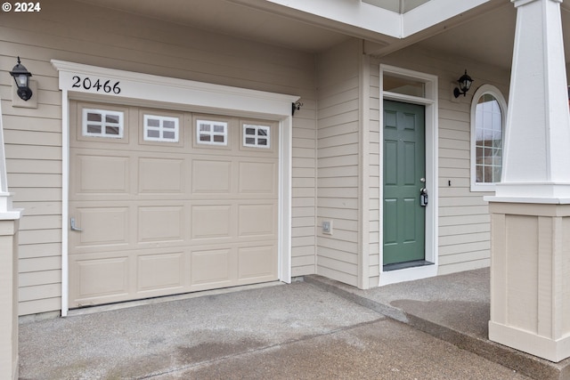 property entrance featuring a garage