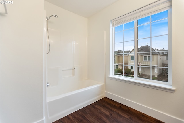 bathroom featuring hardwood / wood-style floors and tub / shower combination