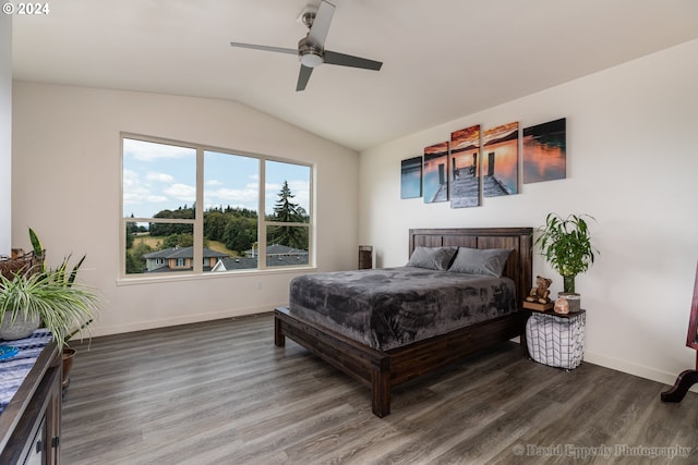 bedroom featuring ceiling fan, lofted ceiling, and dark hardwood / wood-style floors