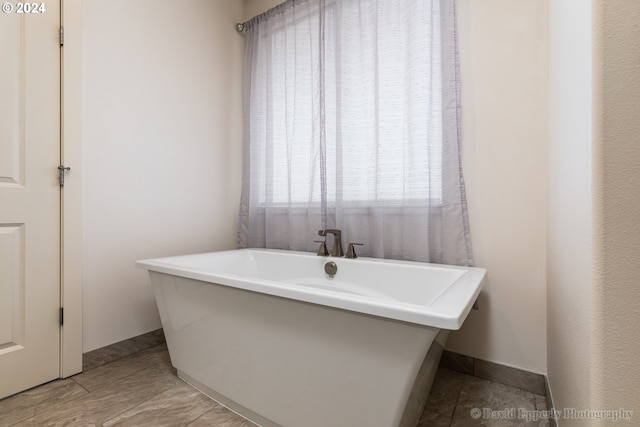 bathroom featuring a washtub