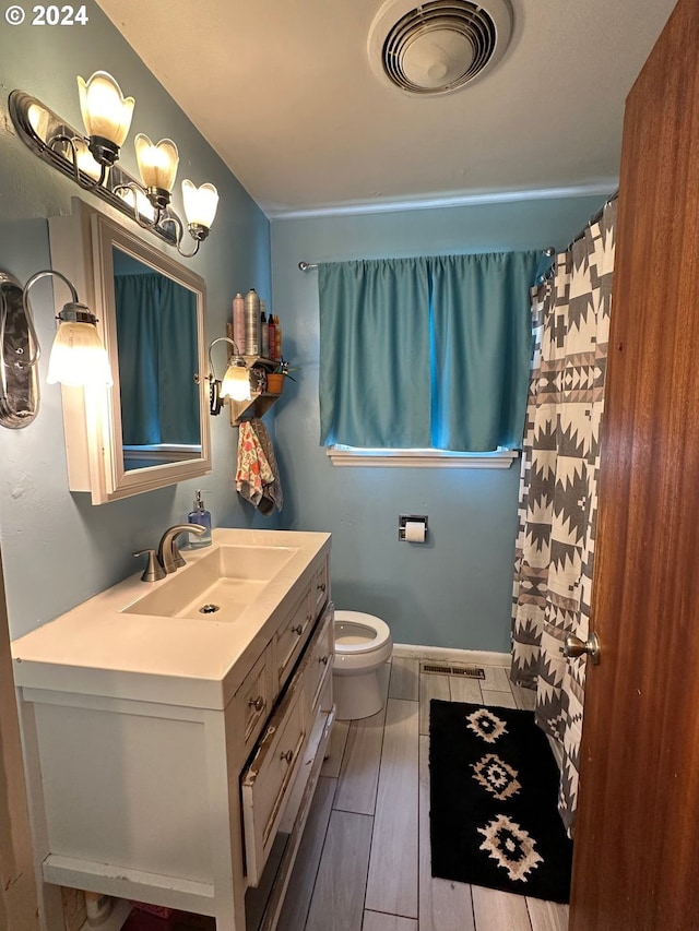 bathroom with vanity and toilet